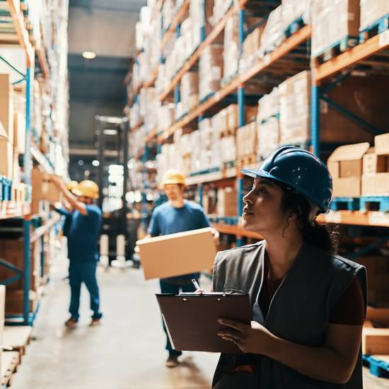 Close up of a group of workers working in a warehouse