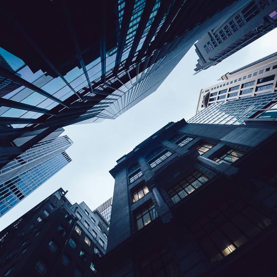 Contemporary financial skyscrapers from ground view against sky