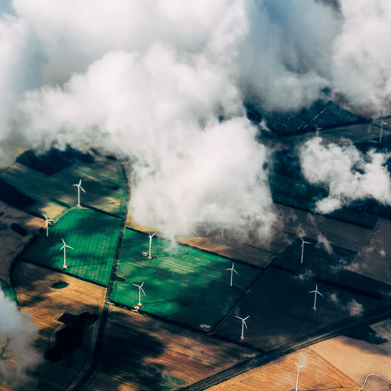 Aerial View Of Wind Turbines On Agricultural Field