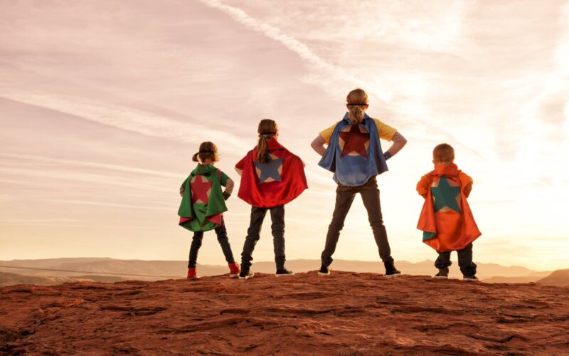 A group of four small superheroes stand up to the bullies of the world. It is never too early to be super. Just add type for the perfect concept.