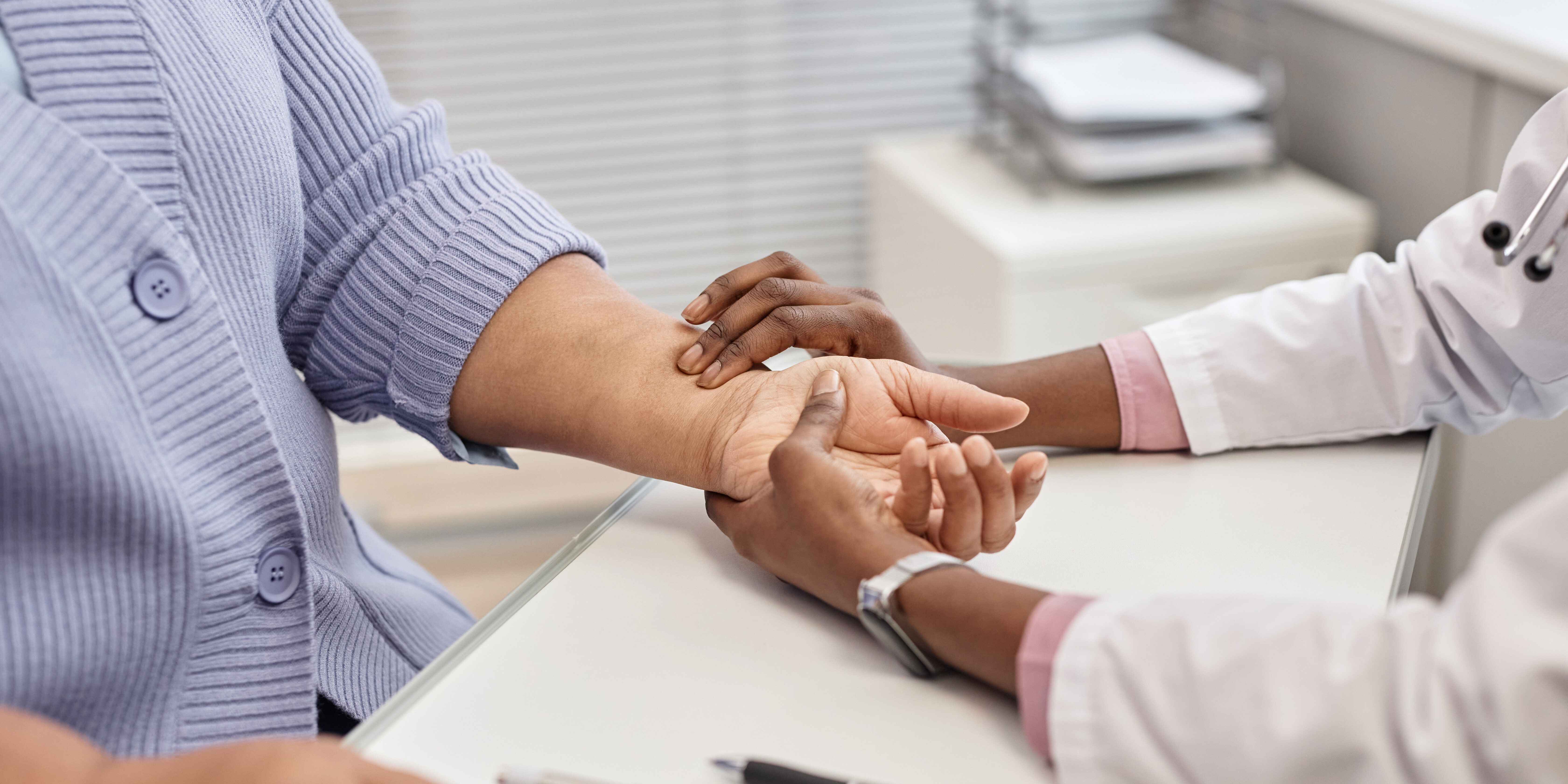 Physician Taking Patients Pulse Rate